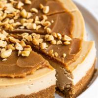 Reese's Peanut Butter Cheesecake Slice with Whip Cream · This delicious NYC cheesecake has original reese’s peanut topping which gives it a smooth an...