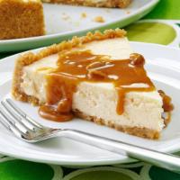 Caramel Cheesecake Slice with Whip Cream · This salted caramel cheesecake is the best! The caramel sauce is buttery and delicious.