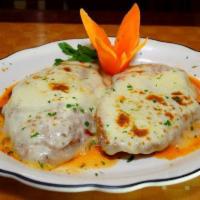 Chicken Cutlet Parmigiana · Served with spaghetti. Served with cup of soup or salad, bread and butter.