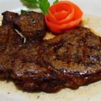 New York Cut Shell Steak · Broiled to perfection served with cup of soup or salad with bread and butter and choice of r...