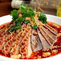 🌶️ Sliced Beef And Ox Tripe In Chili Sauce 夫妻肺片 · Tender beef slices are served in a rich, spicy hot sauce and topped with peanut flakes and c...
