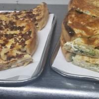 Veggie Stuffed Pizza Slice · Stuffed with broccoli, fresh spinach, mushrooms, onions, peppers, eggplant, Ricotta, Romano ...