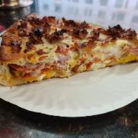 Meat Stuffed Pizza Slice · Stuffed with peppers, onions, sausage, pepperoni, ground beef, Ricotta, Romano and Mozzarell...