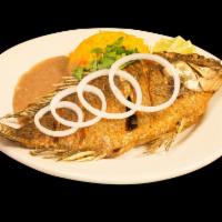 37. Pescado Asados · Tilapia. Sauteed whole fish. Served with rice and fried beans.