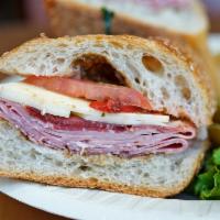 1. Italian Supremo Sandwich · Genoa salami, capicola, sharp provolone, roasted red peppers, and tomatoes with balsamic vin...