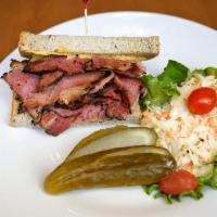 Hot Pastrami Sandwich · Served on Jewish rye with mustard. Served with coleslaw and a pickle.