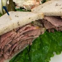 Fresh Brisket of Beef Sandwich · Served on Jewish rye. Served with coleslaw and a pickle.