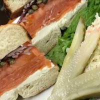 Smoked Salmon and Cream Cheese Bagel · Served on a toasted NY bagel with capers, shaved onions, leaf lettuce and fresh tomatoes. Se...
