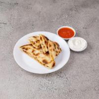 22. Jack Cheese and Grilled Chicken Quesadillas Sincronizadas · Made with 2 soft fresh flour tortillas stuck together with melted cheese.