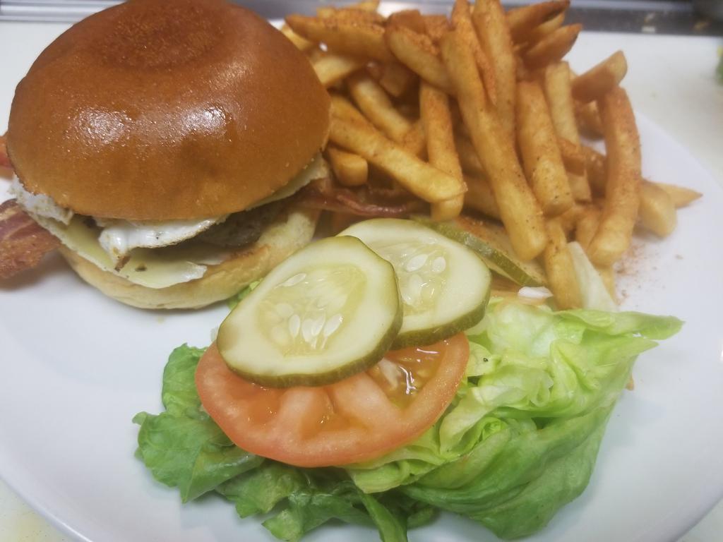 Cheese Burger · 8oz of freshly ground beef topped with american cheese With lettuce, tomatoes, and onions.and Mr.B special burger sauce  served on a toasted brioche bun.