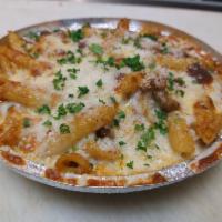 Pasta tajin with beef  · Penne pasta in marinara sauce mixed with ground beef and topped with mozzarella cheese