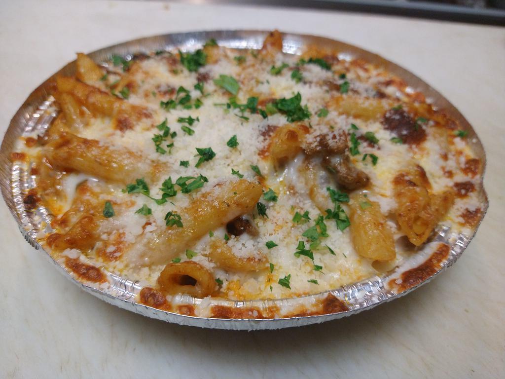 Pasta tajin with beef  · Penne pasta in marinara sauce mixed with ground beef and topped with mozzarella cheese