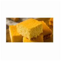 Skillet Cornbread · Slice of a lil buttery, sweet cornbread with a velvety texture. It is moist, soft and tender!