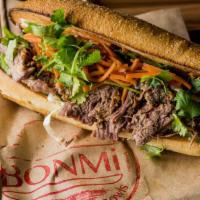 BONMi  Red Eye Banh Mi Sandwich · Asian BBQ 18 hour beef, cucumbers, pickled veggies and cilantro on a crisp baguette. Hot spi...