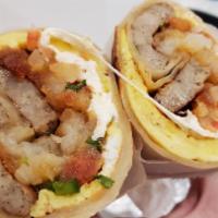 Omelette Burrito · Scrambled Eggs, queso oaxaca, pico de gallo, hash browns, Cholula hot sauce, and your choice...