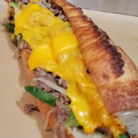 Philly Cheesesteak · shaved ribeye, caramelized onion, peppers, on Hero Bread, your choice of cheese