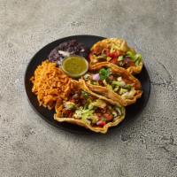 Taco Dinner · Three tacos served with a side of rice and beans. Corn or flour tortilla filled with lettuce...