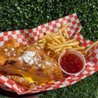 Monte Cristo  · Ham, Turkey, Swiss, and American Cheese battered and fried! Served with beer-battered Fries ...