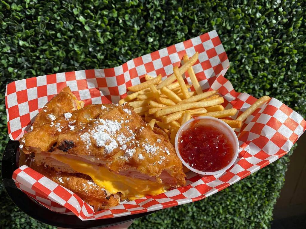 Monte Cristo  · Ham, Turkey, Swiss, and American Cheese battered and fried! Served with beer-battered Fries & jelly 