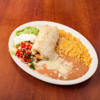 Chimichanga Classic · Flour tortilla filled with your choice of chunks of beef or spicy chicken; deep fried and to...