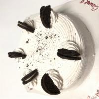 Oreo cookie Cake · A layer of vanilla, a layer of oreo ice-cream and separated by oreo cookie crunchies.