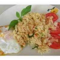 53. Chili Fried Rice · Fried rice, garlic, onions, bell pepper, basil, chili sauce, and egg on top. Spicy.