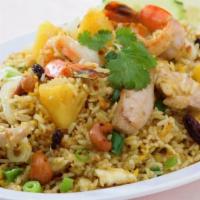 54. Pineapple Fried Rice · Fried rice with carrots, pineapple, egg, onions and cashew nuts.
