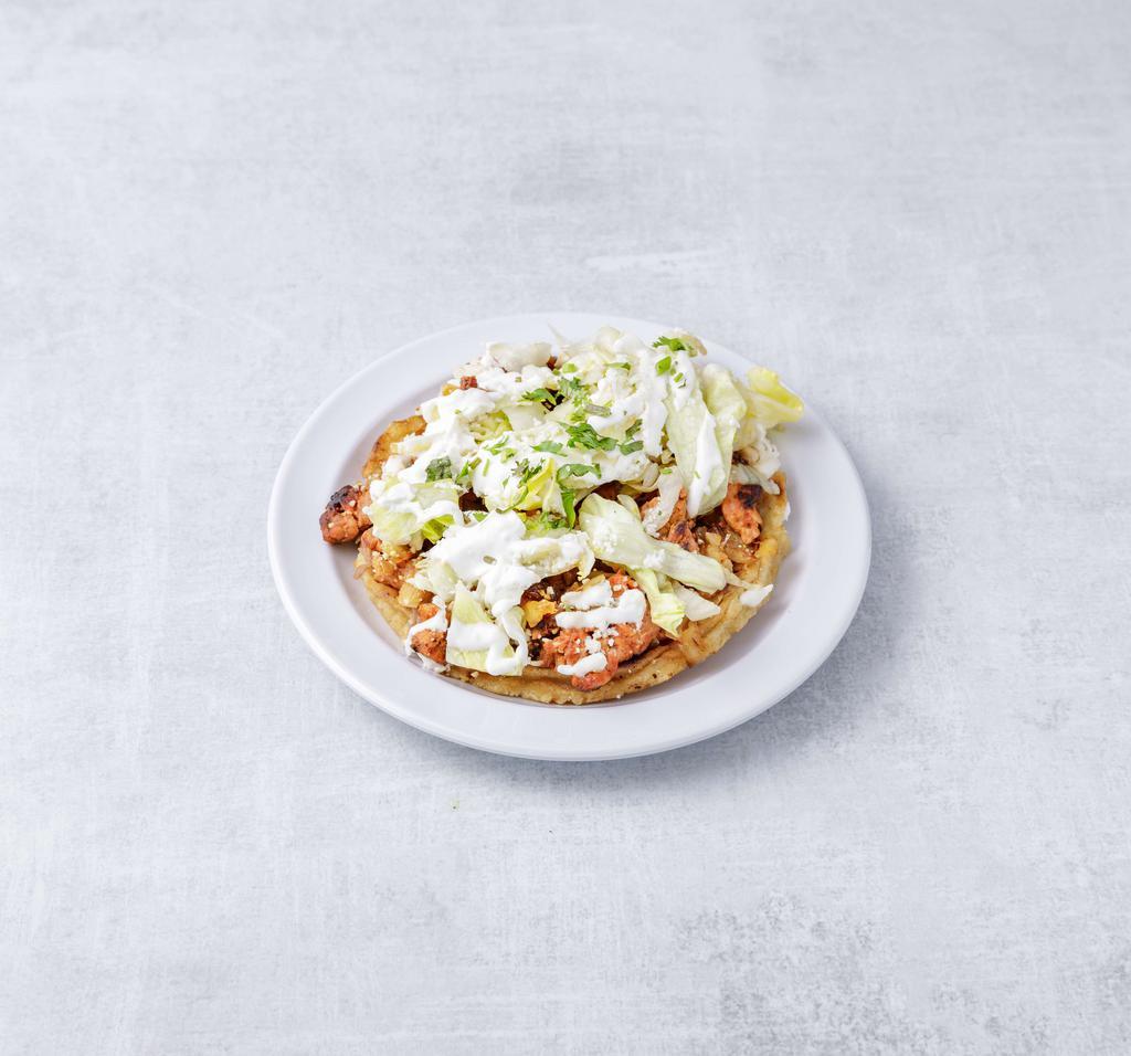 Sopes · Grilled Mexican corn dough patties topped with choice of meat, lettuce, queso fresco and sour cream.