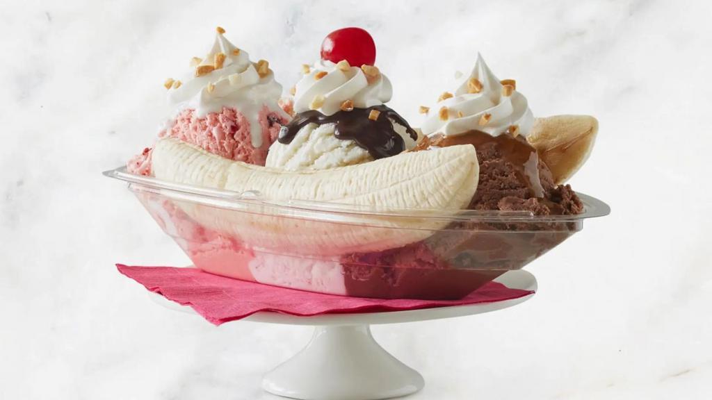 Banana Split · A split banana with Chocolate, Vanilla and Strawberry Ice Cream.  Garnished with Marshmallow sauce, Fresh Strawberries and hot fudge.  Topped with Whipped Cream, Sundae nuts and a cherry.