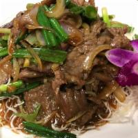 Mongolian Beef · Thinly sliced beef, scallions, garlic and ginger are stir-fried with a savory brown sauce an...
