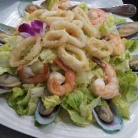 Seafood Salad · Mussels, shrimps, fried calamari spring mix and chiefs dressing.