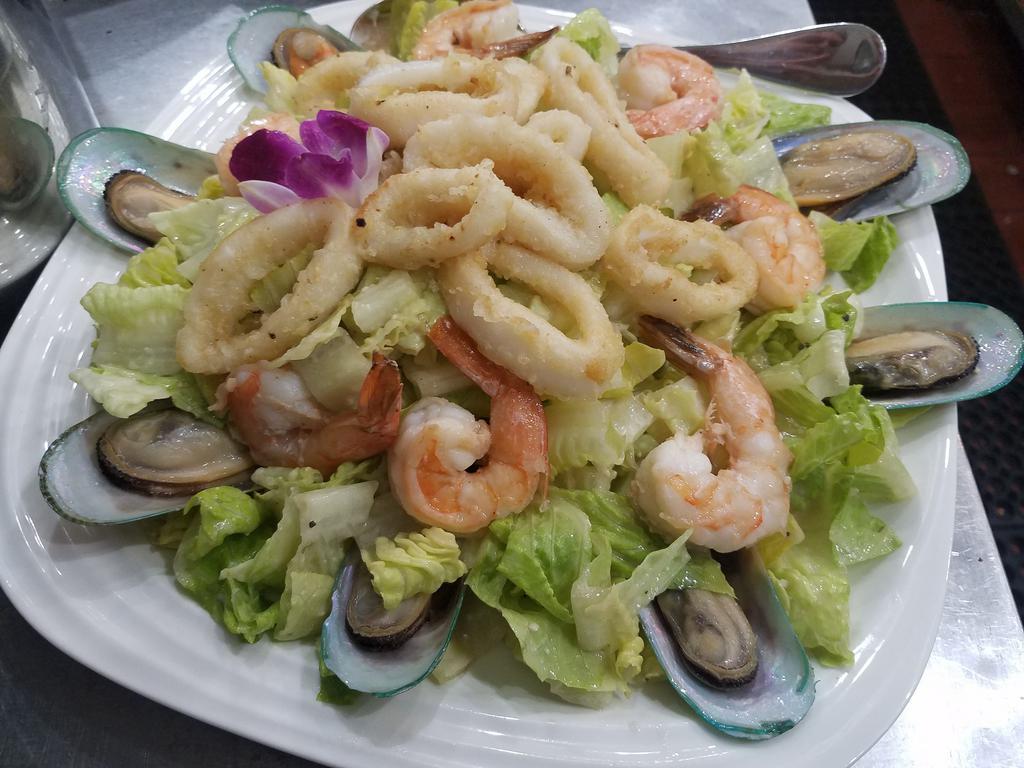 Seafood Salad · Mussels, shrimps, fried calamari spring mix and chiefs dressing.