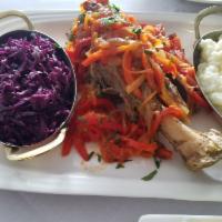Lamb Shank · Served with mashed potatoes and braised red cabbage.