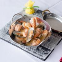 Seafood in a Wok Pan · Lobster tail, calamari, mussels and shrimps with chef’s special sauce.