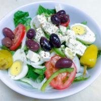 Greek Salad · Crisp romaine and iceberg lettuce, tomato, cucumbers, green peppers, onions and egg topped w...