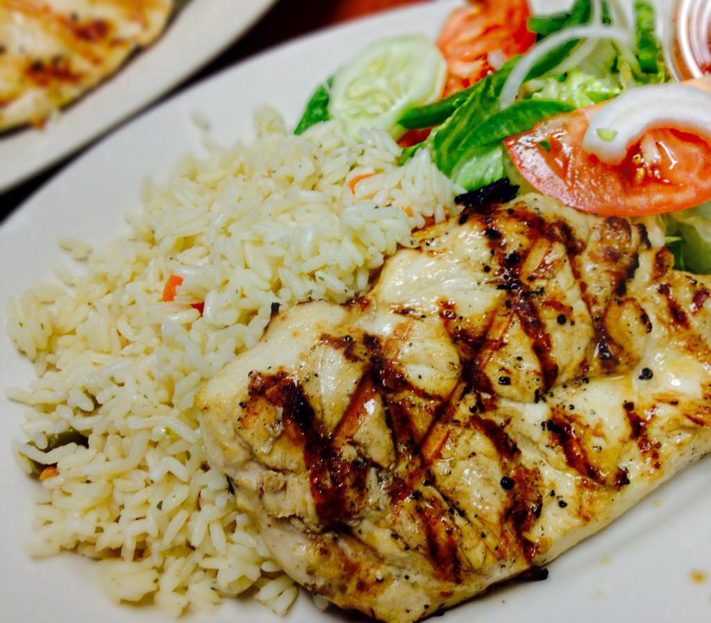 Char Broiled Chicken Breast Dinner · Char-broiled marinated breast of chicken, served with tender and juicy with pita, salad and rice.