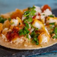 Baja Fish Tacos · Lightly battered white fish, made 