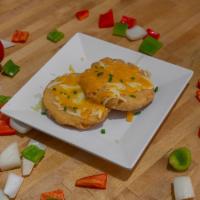 Cheesy Arepas · 2 arepas with Jack and cheddar cheese.