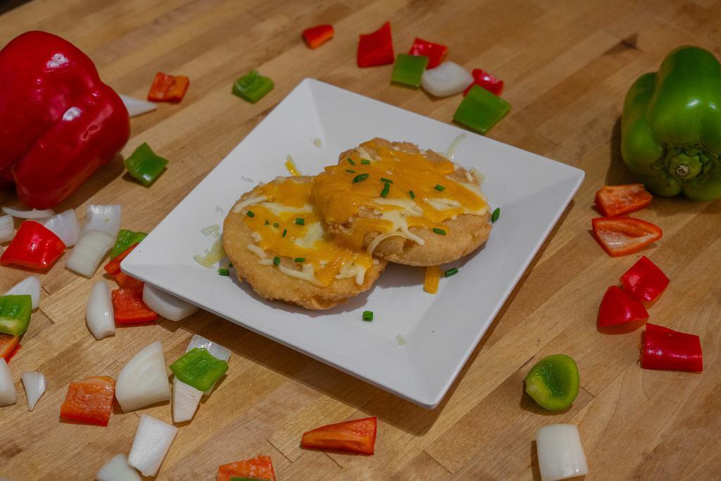 Cheesy Arepas · 2 arepas with Jack and cheddar cheese.