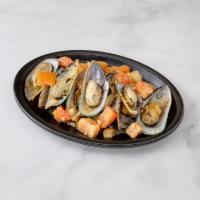 Steamed New Zealand Mussels · In fennel and white wine broth.