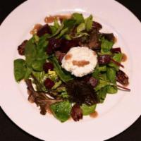 Warm Goat Cheese and Roasted Beet Salad · On mesclun greens with candied pecans and raspberry vinaigrette.