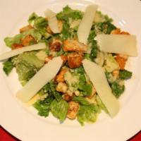 Insalata di Giulio Caesar · Classic style Caesar salad with shaved Pecorino Romano and croutons.