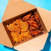 Bone In Wings (20 Pieces ) · Wings tossed with your choice of flavors and served with your choice of fries, waffle fries ...