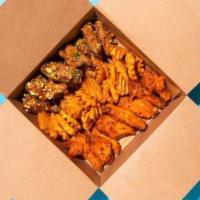 Bone In Wings (12 Pieces - 2 Flavors) · Wings tossed with your choice of flavors and served  with your choice of fries, waffle fries...