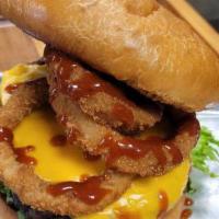 JB’s Onion Ring Burger · Premium short rib burger topped with American cheese, onion rings, pickle, lettuce, tomato, ...
