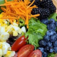 Farmers harvest Salad  · Mixed greens, cherry tomato, carrots, dried cranberries, fresh beries,chopped eggs and Serve...