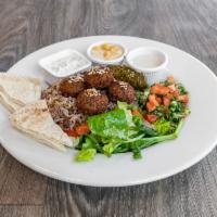 Greek  Lunch Platter · Falafel with lentil rice, hummus, tabbouleh, cucumber salad, Greek salad, dolma and pita bre...