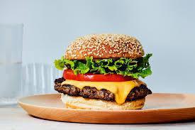 Cheese Burger  · Includes: Lettuce, Tomato, Grilled Onion and House Dressing