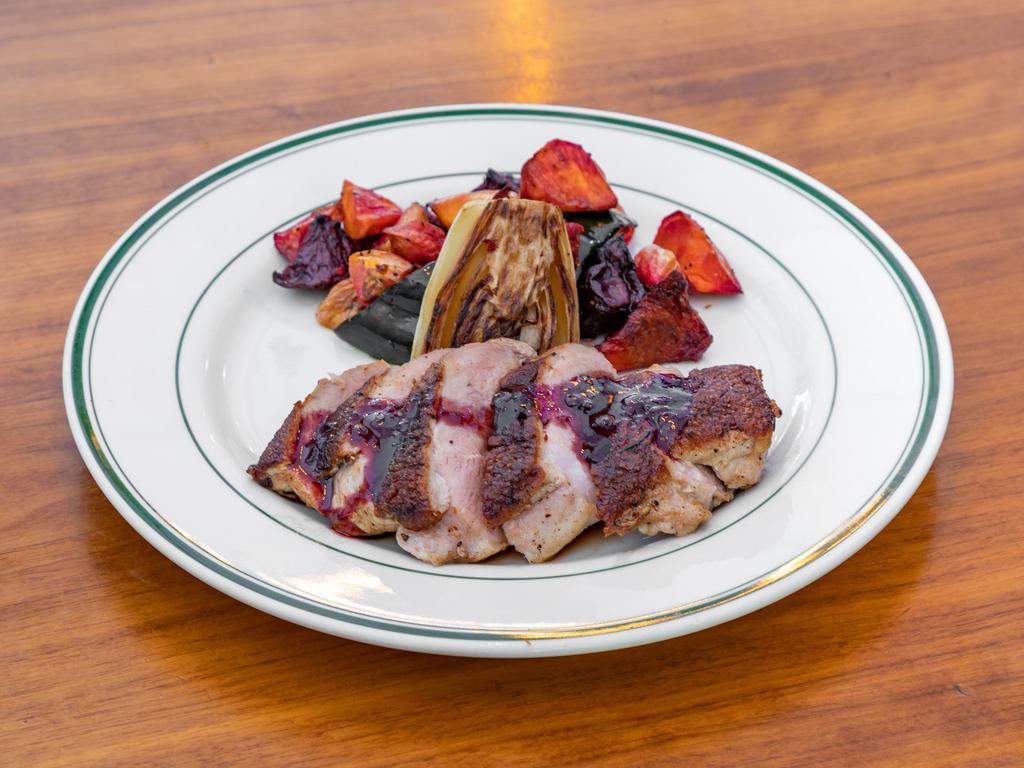 Duck Breast · Red currant gravy, caramelized endive, roasted winter vegetables.