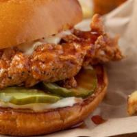 Spicy Chicken Sandwich · Breaded Chicken, white bbq sauce, hot honey, brioche bun